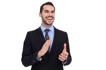 Happy businessman standing and clapping