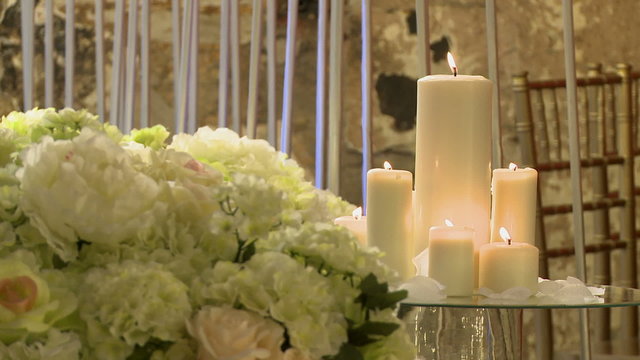 Lighted candles and flowers as decoration interior