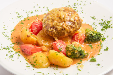 klops of veal with bacon, capers, grated cheese in a creamy