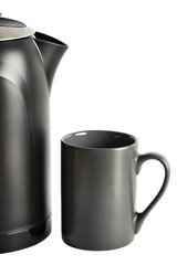 Modern kettle and cup isolated on white