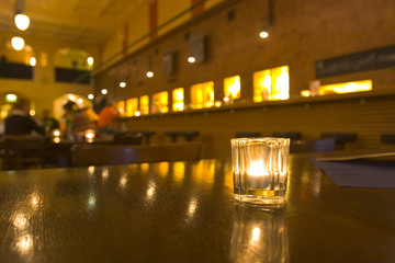 Bar scene with candle