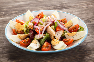 Boiled eggs with roast chicken fillet and vegetables