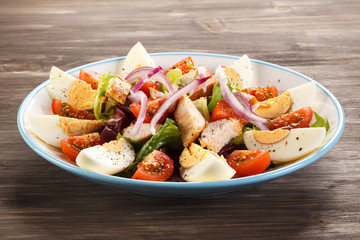 Boiled eggs with roast chicken fillet and vegetables