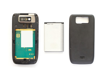 Old cellphone backside with battery.