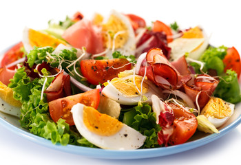 Boiled eggs with smoked ham and vegetables