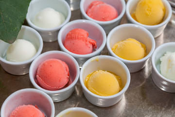 Cups of different flavors of ice cream