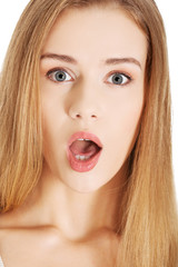 Portrait of shocked blonde woman