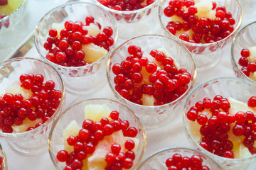 Fresh berry and pineapple in cups