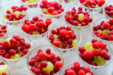 Fresh berry and pineapple in cups