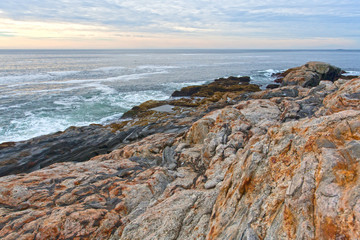 Fototapeta na wymiar Rock ledges and sea at Pemaquid Point, Maine