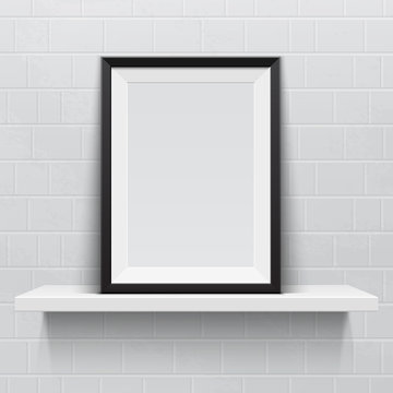 Realistic picture frame on white realistic shelf, against brick