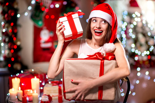 Young woman with present box on Christmas
