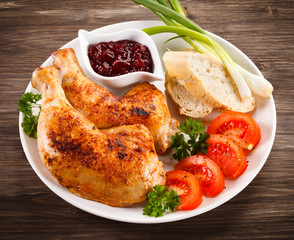 Grilled chicken drumsticks and vegetables