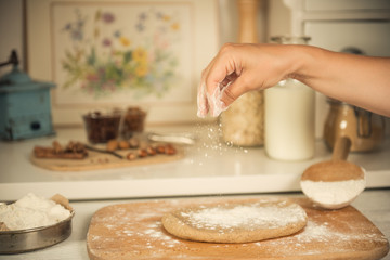 Sprinkling dough with flour