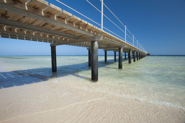 Fototapeta premium Wooden jetty on tropical beach