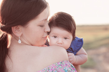 baby with mother outdoor