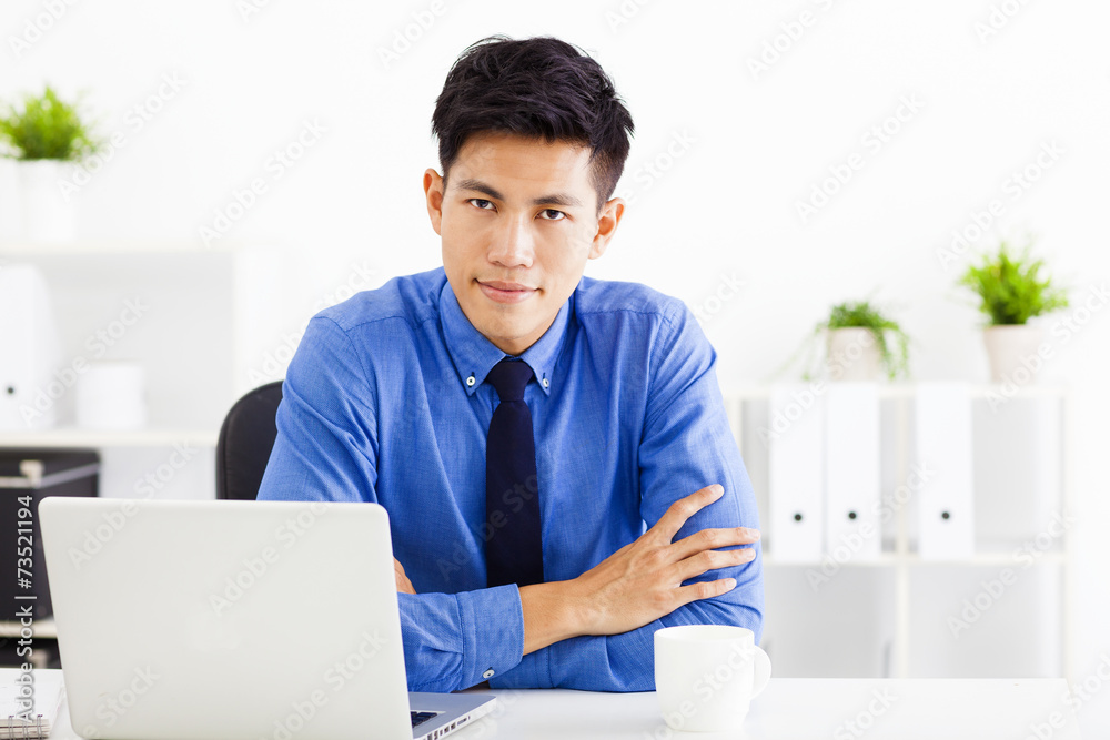 Wall mural young business man working in the office