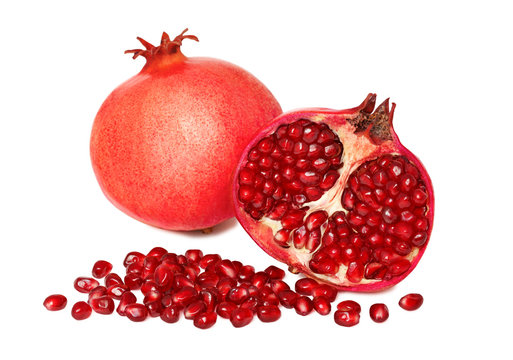 One whole and a half pomegranates with seeds (isolated)
