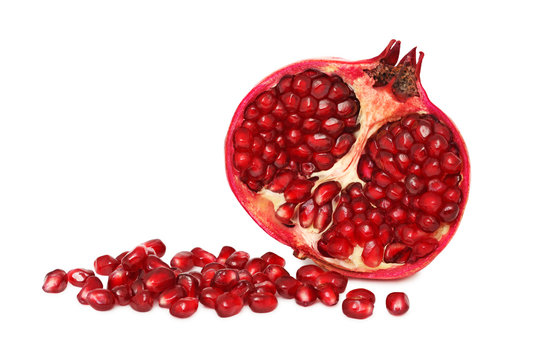 A half pomegranate with seeds (isolated)
