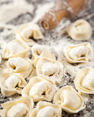 Flour And Raw Ravioli Pasta On Counter
