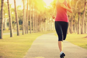 Papier Peint photo autocollant Jogging woman runner athlete running at tropical park