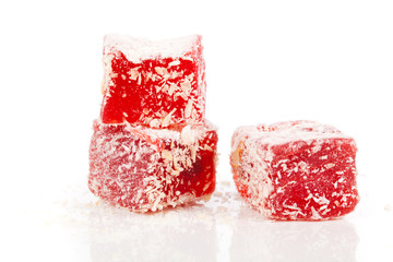 Sweet pieces of turkish delight on white background