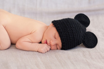 cute newborn baby in black mouse hat - 73523521