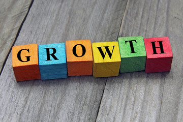 concept of growth word on wooden colorful cubes