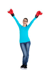 Attractive young woman wearing boxing gloves