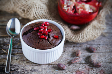 Chocolate mud cake with pomgranate syrup and seeds, dessert