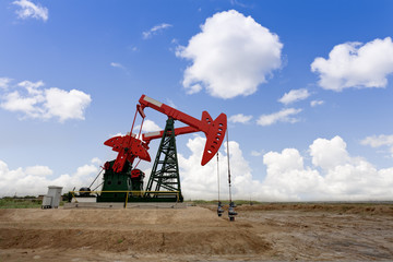 Fototapeta na wymiar Working oil pump jacks on a oil field