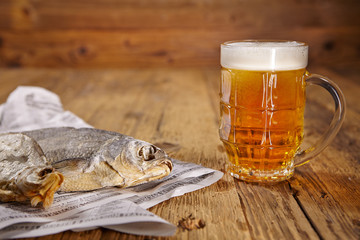 Russian snack . Beer and dried fish