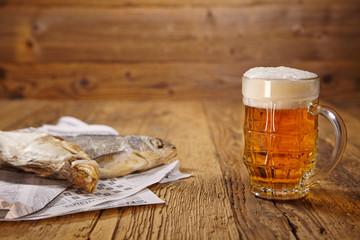 Russian snack . Beer and dried fish