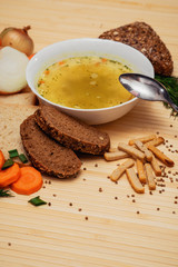 broth with bread and vegetables