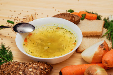 broth with bread and vegetables