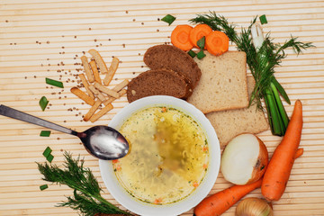 broth with bread and vegetables