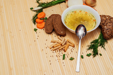 broth with bread and vegetables