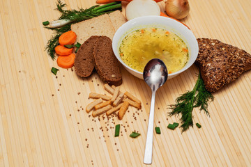 broth with bread and vegetables