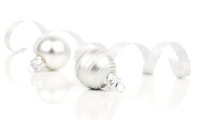 white christmas decoration balls with satin ribbon, isolated on