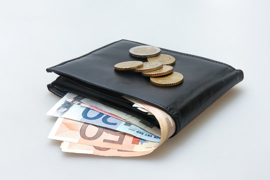 Black leather wallet with Euro notes and coins