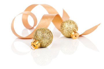 two golden christmas decoration balls with satin ribbon, isolate