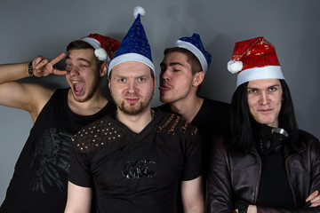 The man's metal band in christmas hats