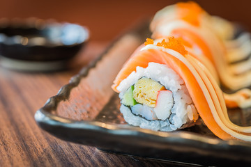 Salmon sushi roll maki © siraphol