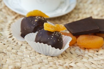 Handmade chocolate truffle with dried apricots