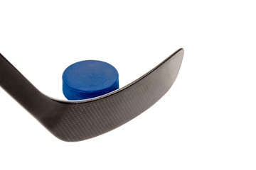 Hockey stick and blue puck