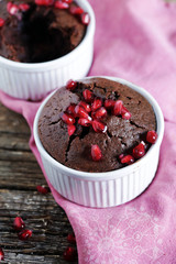 Coffee chocolate cupcake in ramekin with pomegranate