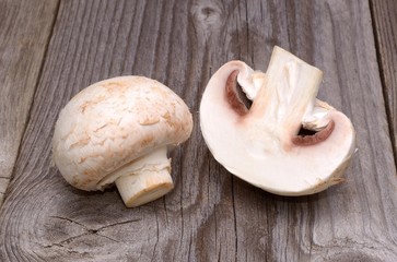 Champignon on wooden background