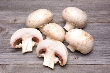 Champignon on wooden background