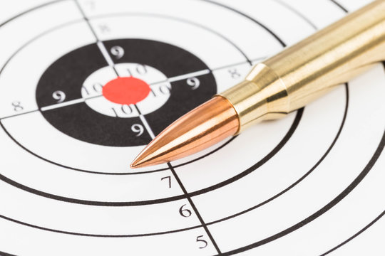 Rifle bullet over target background