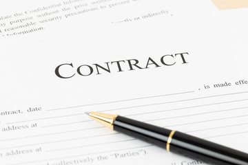 Business contract document with pen